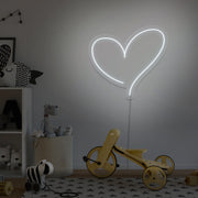 cold white love heart neon sign hanging on kids bedroom wall