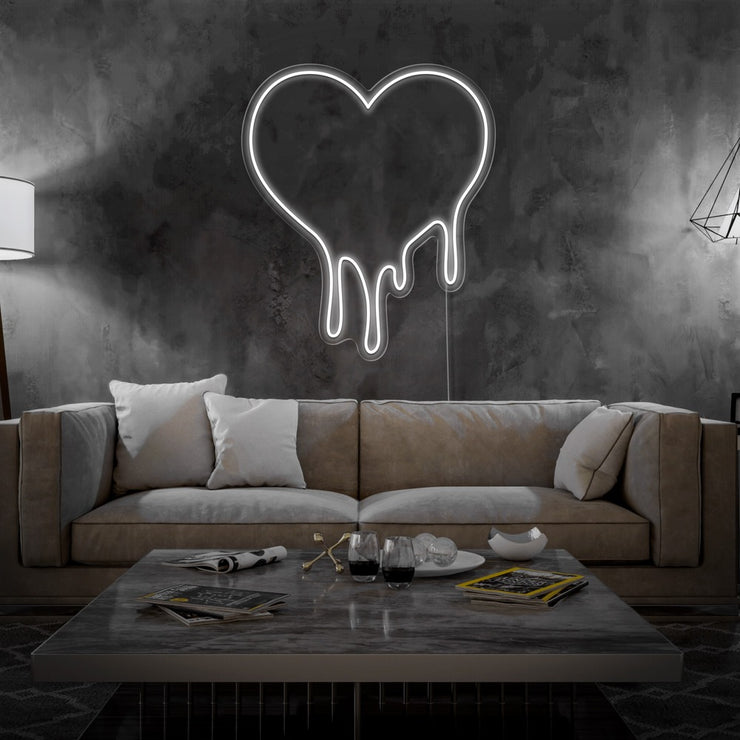 cold white melting heart neon sign hanging on living room wall