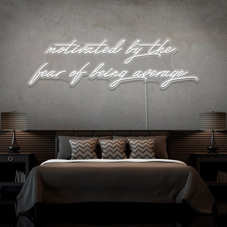 cold white motivated by the fear of being average neon sign hanging on bedroom wall