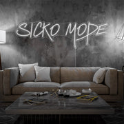 cold white sicko mode neon sign hanging on living room wall