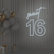 cold white sweet 16 neon sign hanging on wall