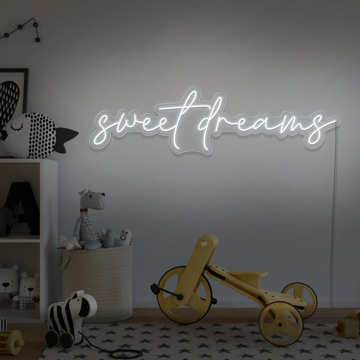 cold white sweet dreams neon sign hanging on kids bedroom wall