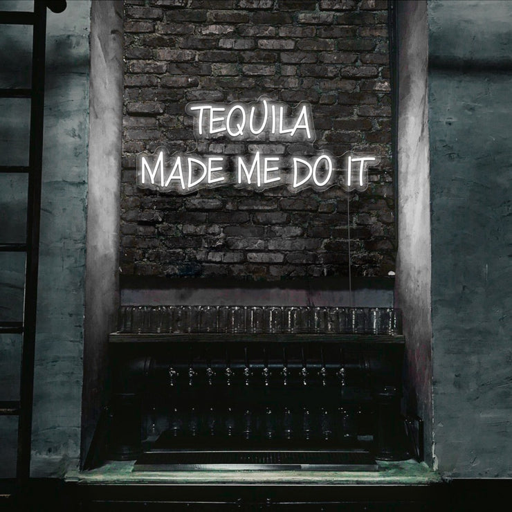 cold white tequila made me do it neon sign hanging on bar wall
