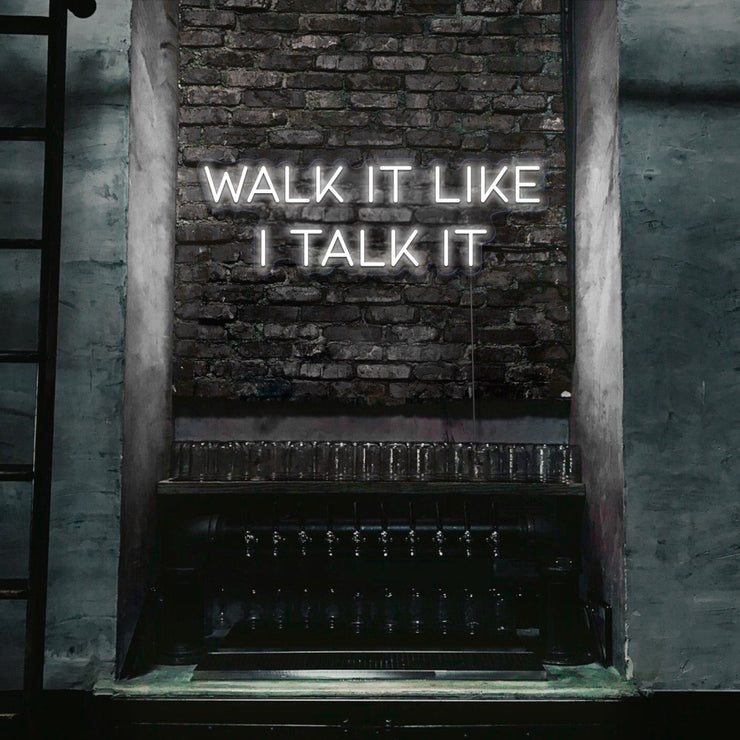 cold white walk it like i talk it neon sign hanging on bar wall