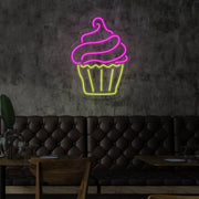 cupcake neon sign hanging on cafe wall