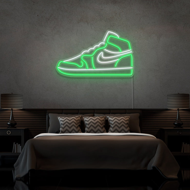 green air jordan 1 sneaker neon sign hanging on bedroom wall