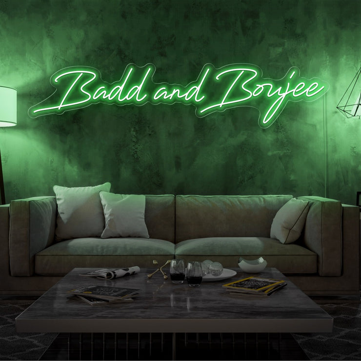 green bad and boujee neon sign hanging on living room wall