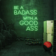 green be a badass with a good ass neon sign hanging on gym wall
