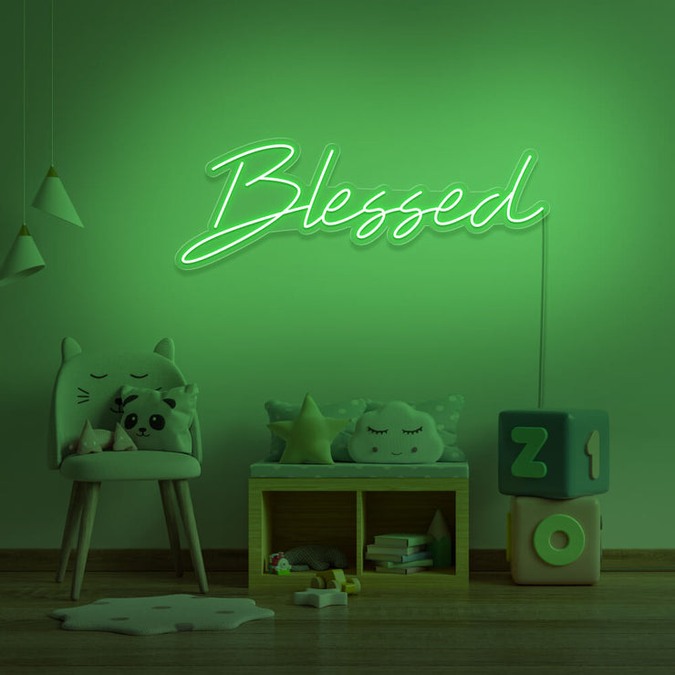 green blessed neon sign hanging on kids bedroom wall