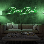 green boss babe neon sign hanging on living  room wall