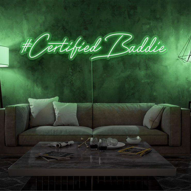 green certified baddie neon sign hanging on living room wall