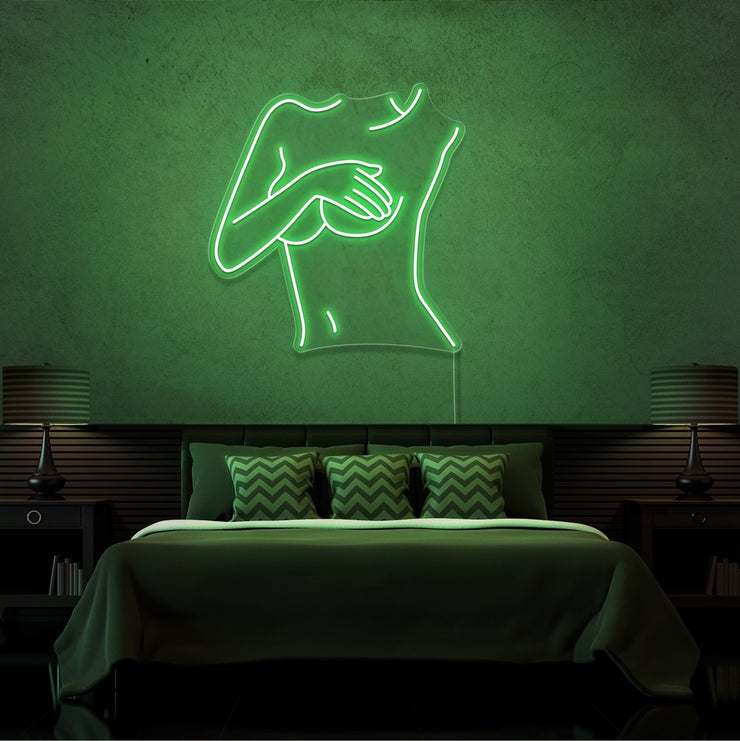 green cover up neon sign hanging on bedroom wall