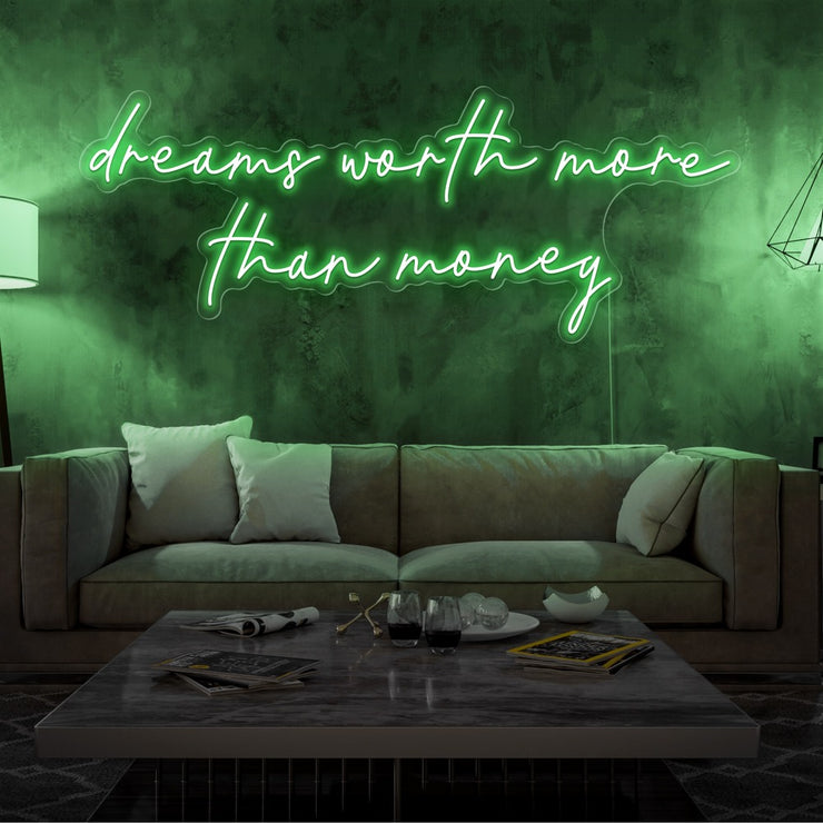 green dreams worth more than money neon sign hanging on living  room wall