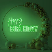 green happy birthday neon sign hanging inside gold hoop balloon backdrop