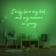 purple I only love my bed and my momma I'm sorry neon sign hanging on kids wall