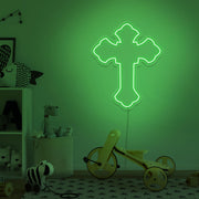 green cross neon sign hanging on kids bedroom wall