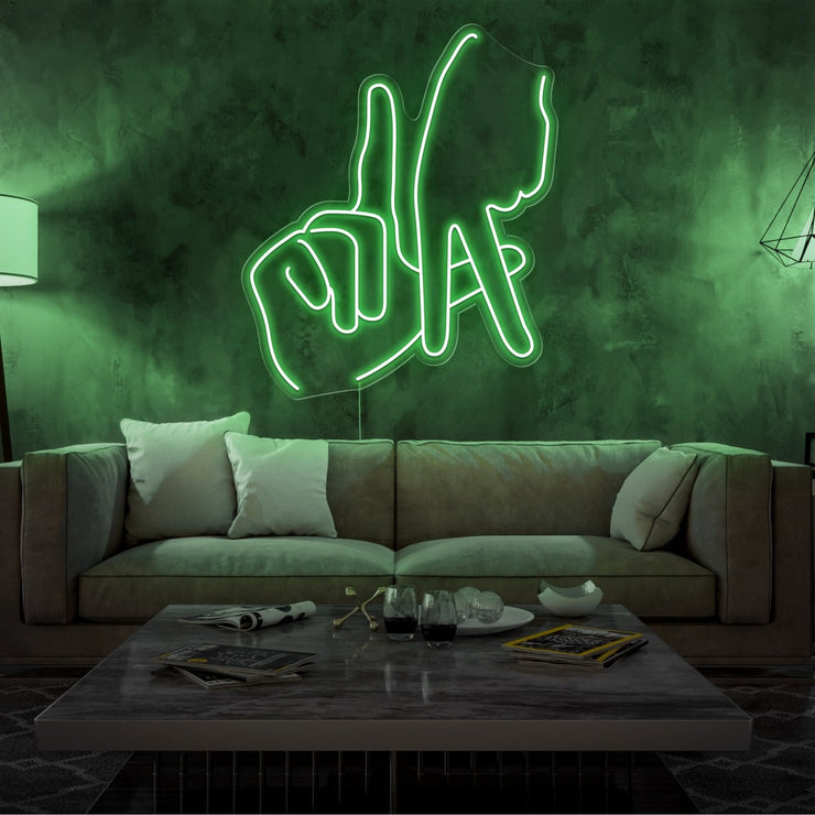green LA fingers neon sign hanging on living room wall
