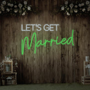 green lets get married neon sign hanging on timber wall