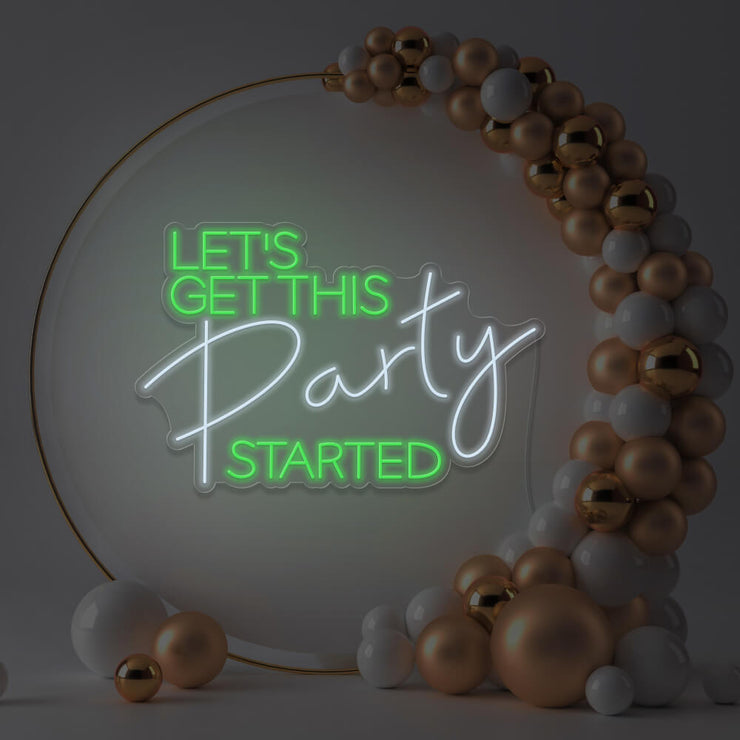 green lets get this party started neon sign hanging in gold hoop frame