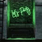 green lets party neon sign hanging on bar wall