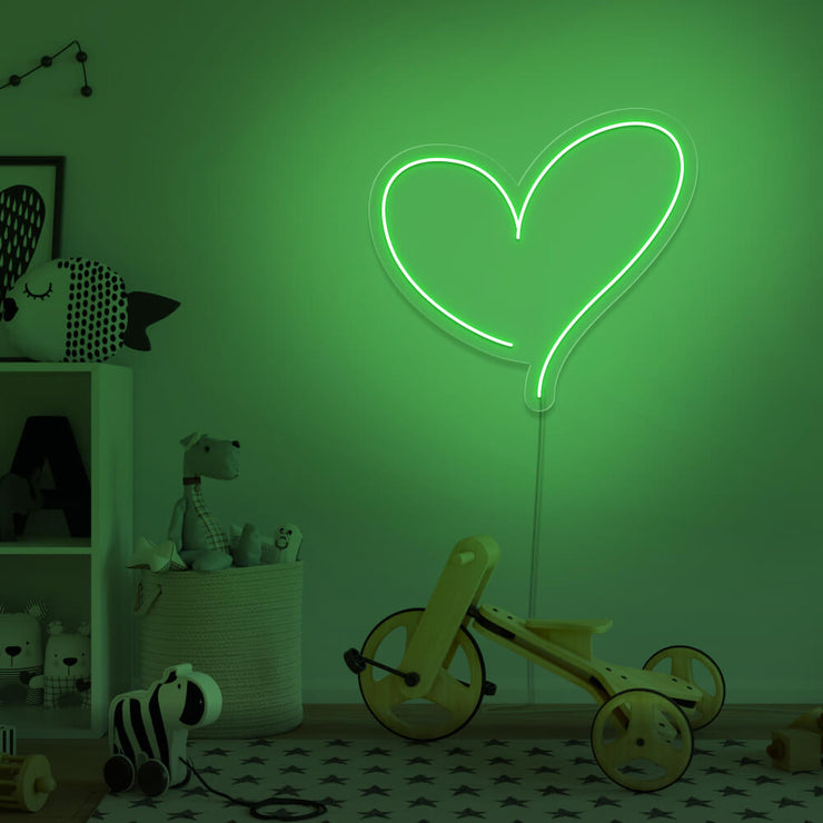 green love heart neon sign hanging on kids bedroom wall