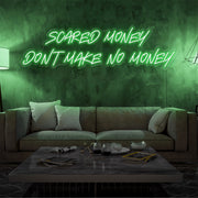 green scared money dont make no money neon sign hanging on living room wall