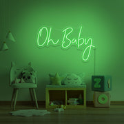 green oh baby neon sign hanging on kids bedroom wall