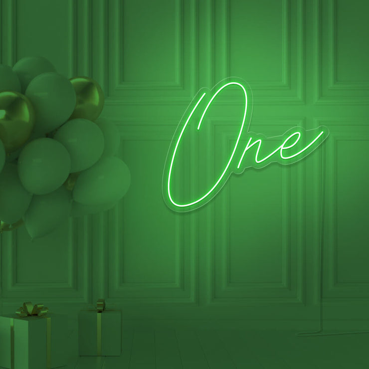 green 1st birthday neon sign hanging on wall with balloons