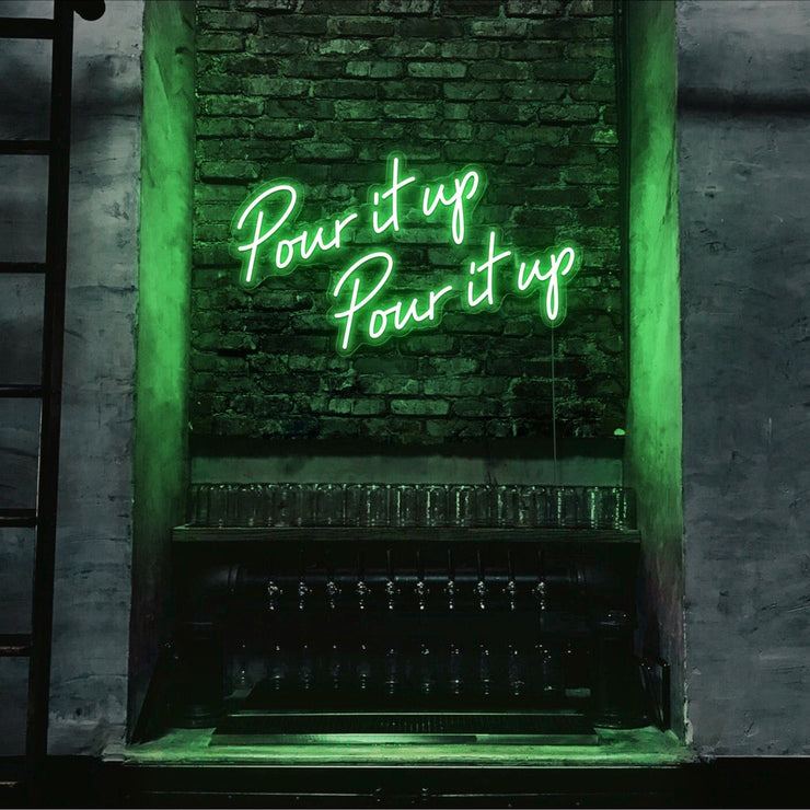 green pour it up neon sign hanging on bar wall