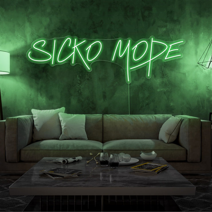 green sicko mode neon sign hanging on living room wall
