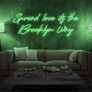 green spread love the brooklyn way neon sign hanging on living room wall