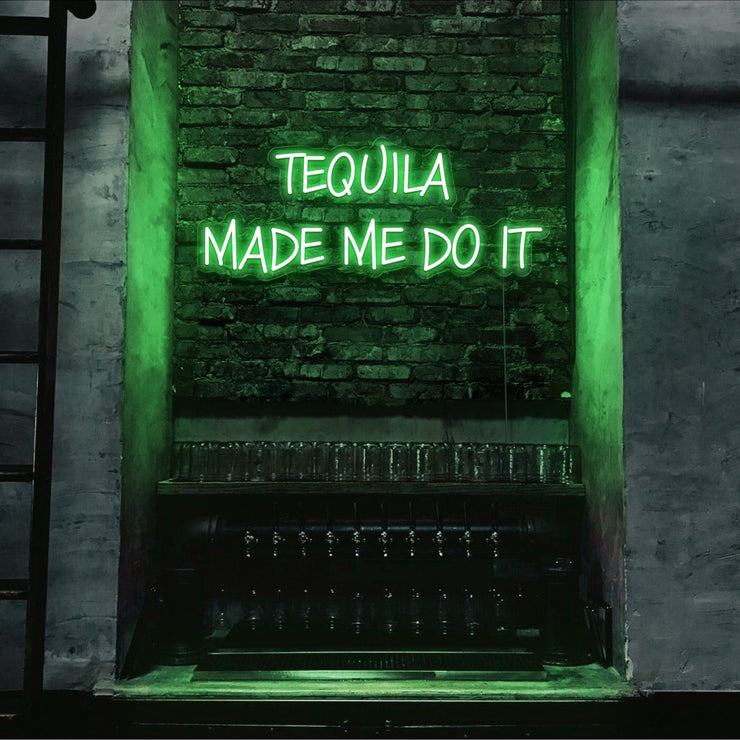green tequila made me do it neon sign hanging on bar wall