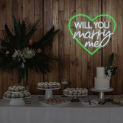 green will you marry me heart neon sign hanging on timber wall above dessert table