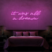 hot pink it was all a dream neon sign hanging on bedroom wall