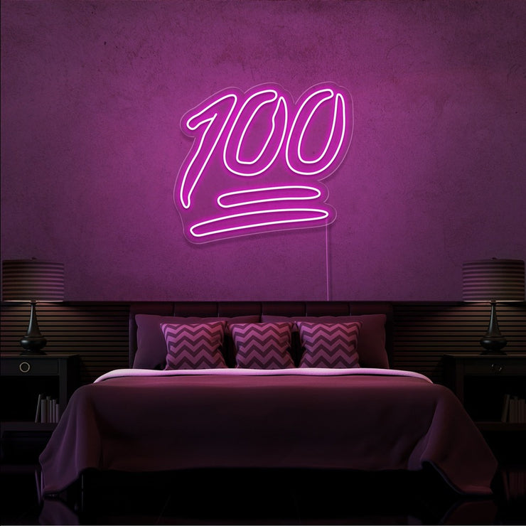 hot pink 100 neon sign hanging on bedroom wall