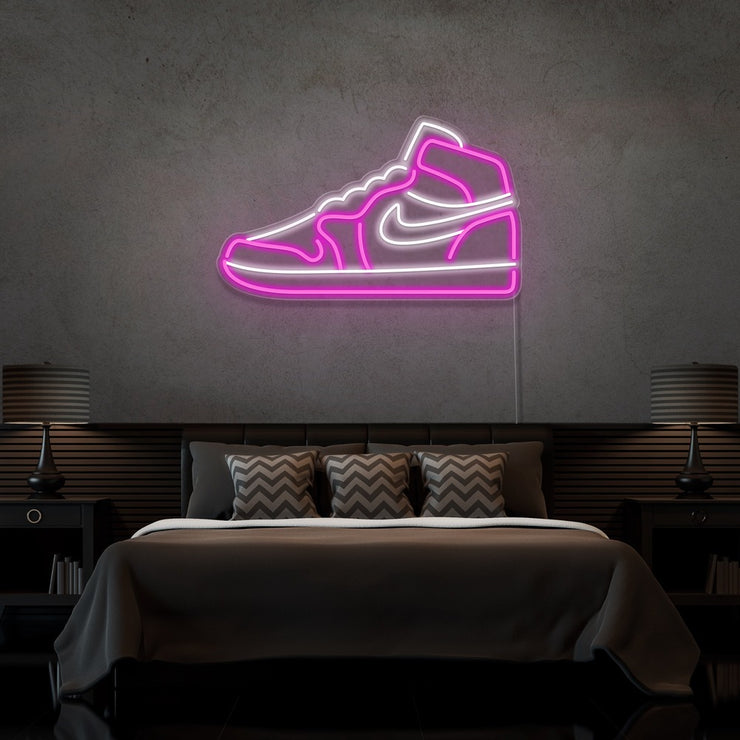 hot pink air jordan 1 sneaker neon sign hanging on bedroom wall