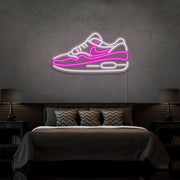 hot pink air max 1 sneaker neon sign hanging on bedroom wall