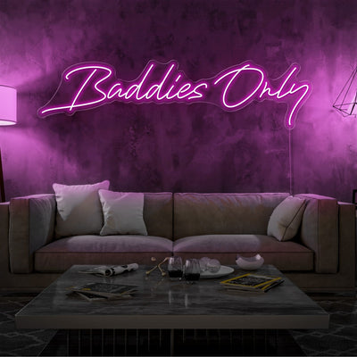hot pink baddies only neon sign hanging on living  room wall