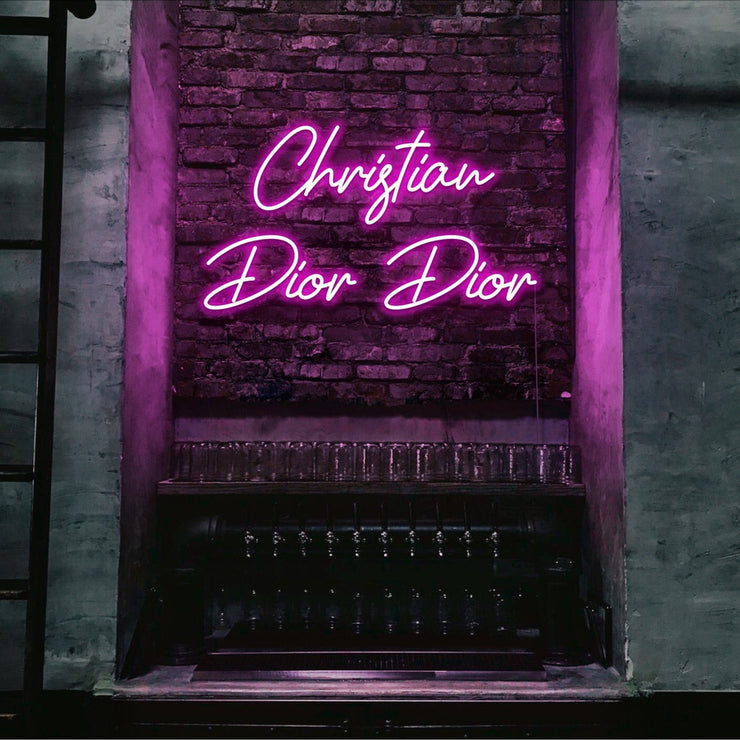 hot pink christian dior dior neon sign hanging on bar wall