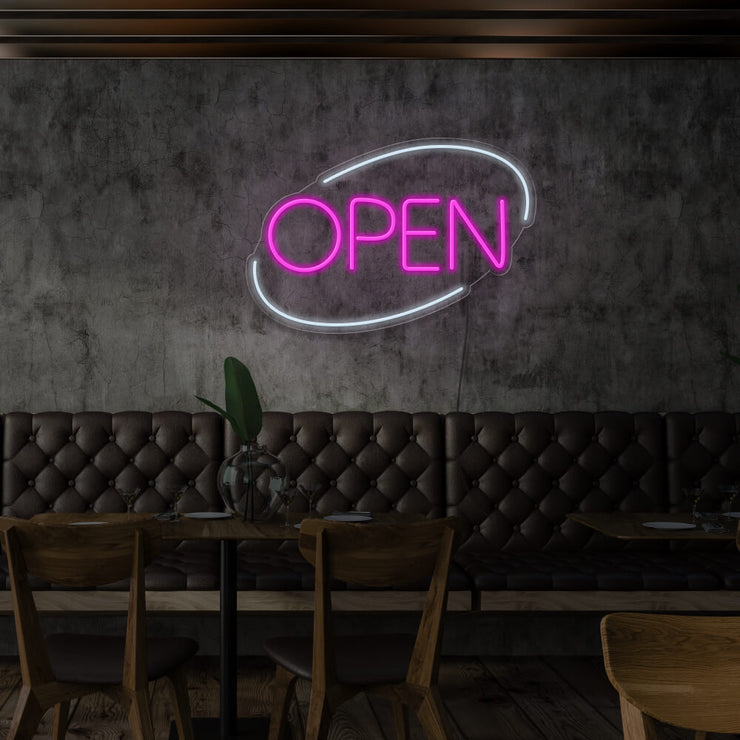 hot pink open neon sign hanging on restaurant wall