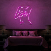 hot pink cover up neon sign hanging on bedroom wall