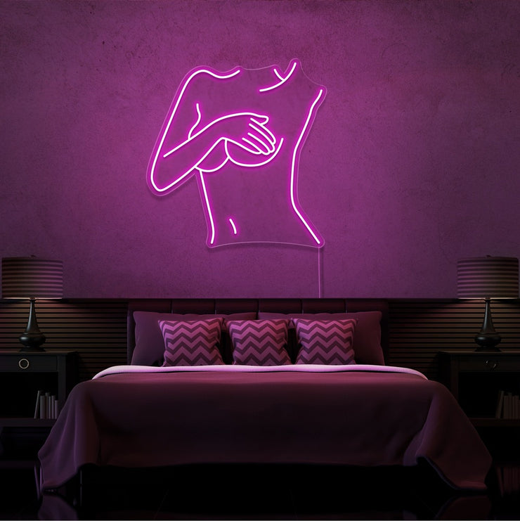 hot pink cover up neon sign hanging on bedroom wall
