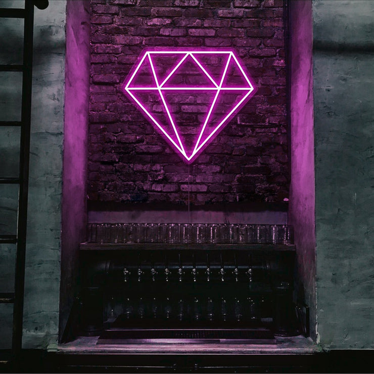 hot pink diamond neon sign hanging on bar wall