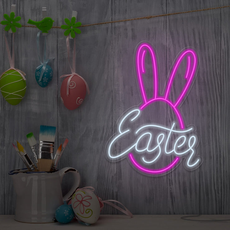 hot pink easter bunny neon sign hanging on wall