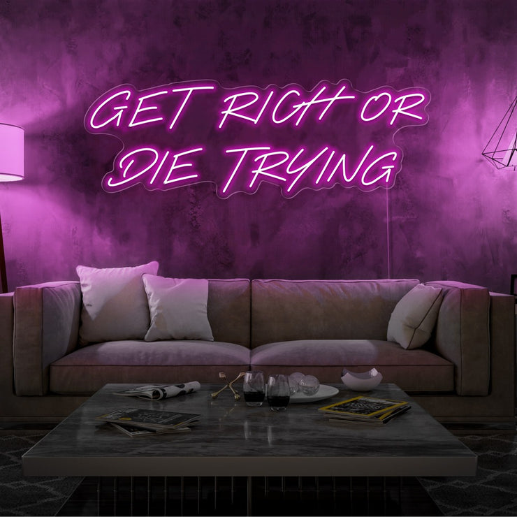 hot pink get rich or die trying neon sign hanging  on living room wall