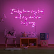 hot pink I only love my bed and my momma I'm sorry neon sign hanging on kids wall