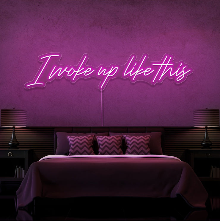 hot pink i woke up like this neon sign hanging on bedroom wall