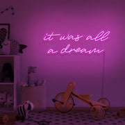 hot pink it was all a dream neon sign hanging on kids bedroom wall