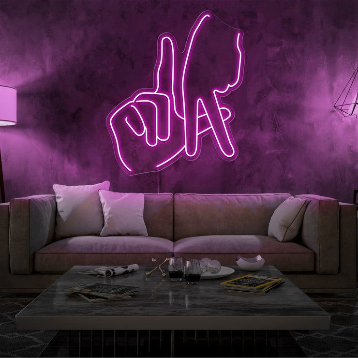 hot pink LA fingers neon sign hanging on living room wall