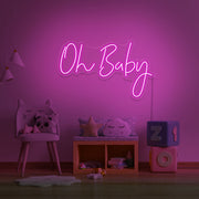 hot pink oh baby neon sign hanging on kids bedroom wall